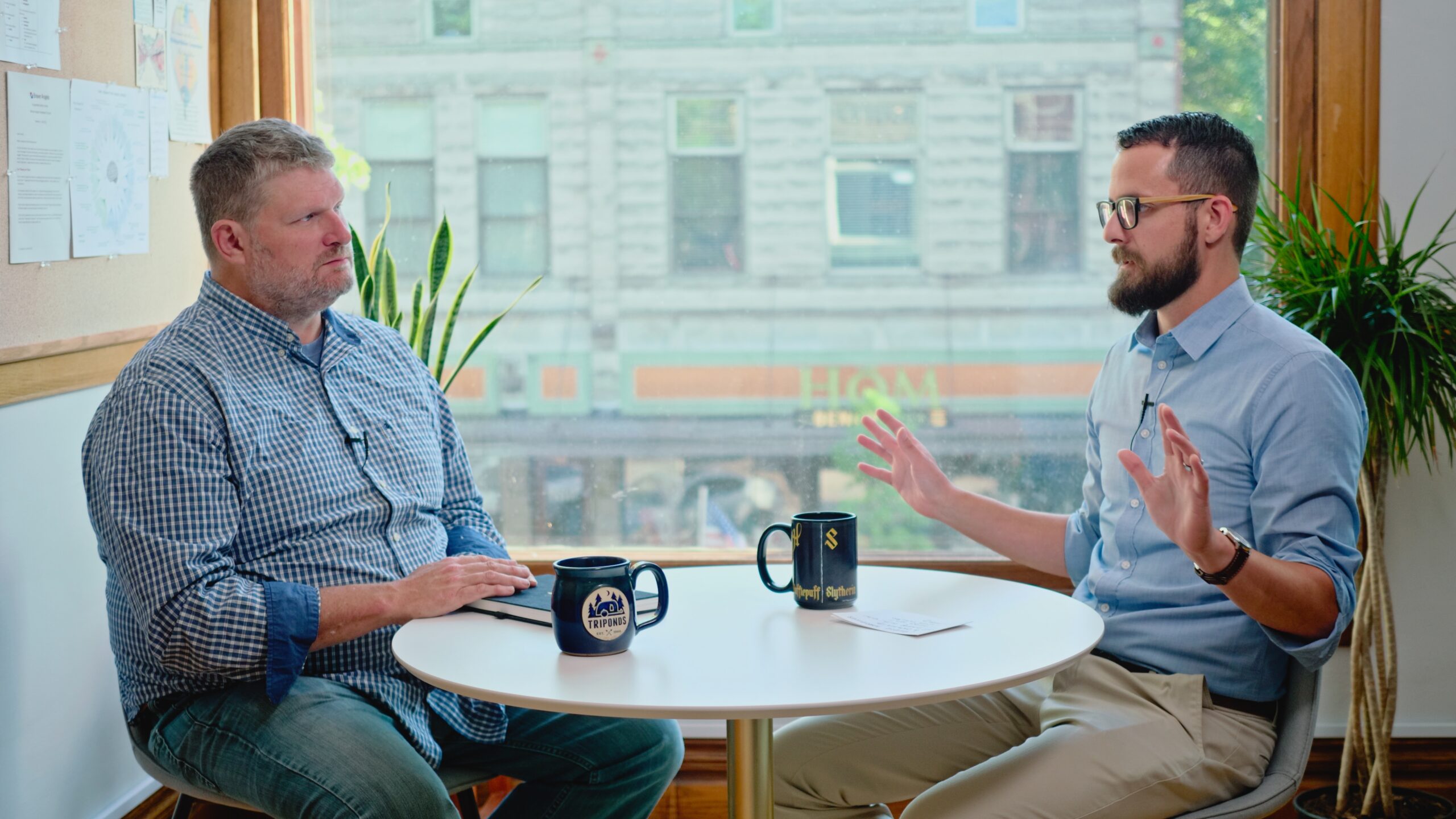 Dan Broersma and Vince Boileau sitting at a table having a conversation