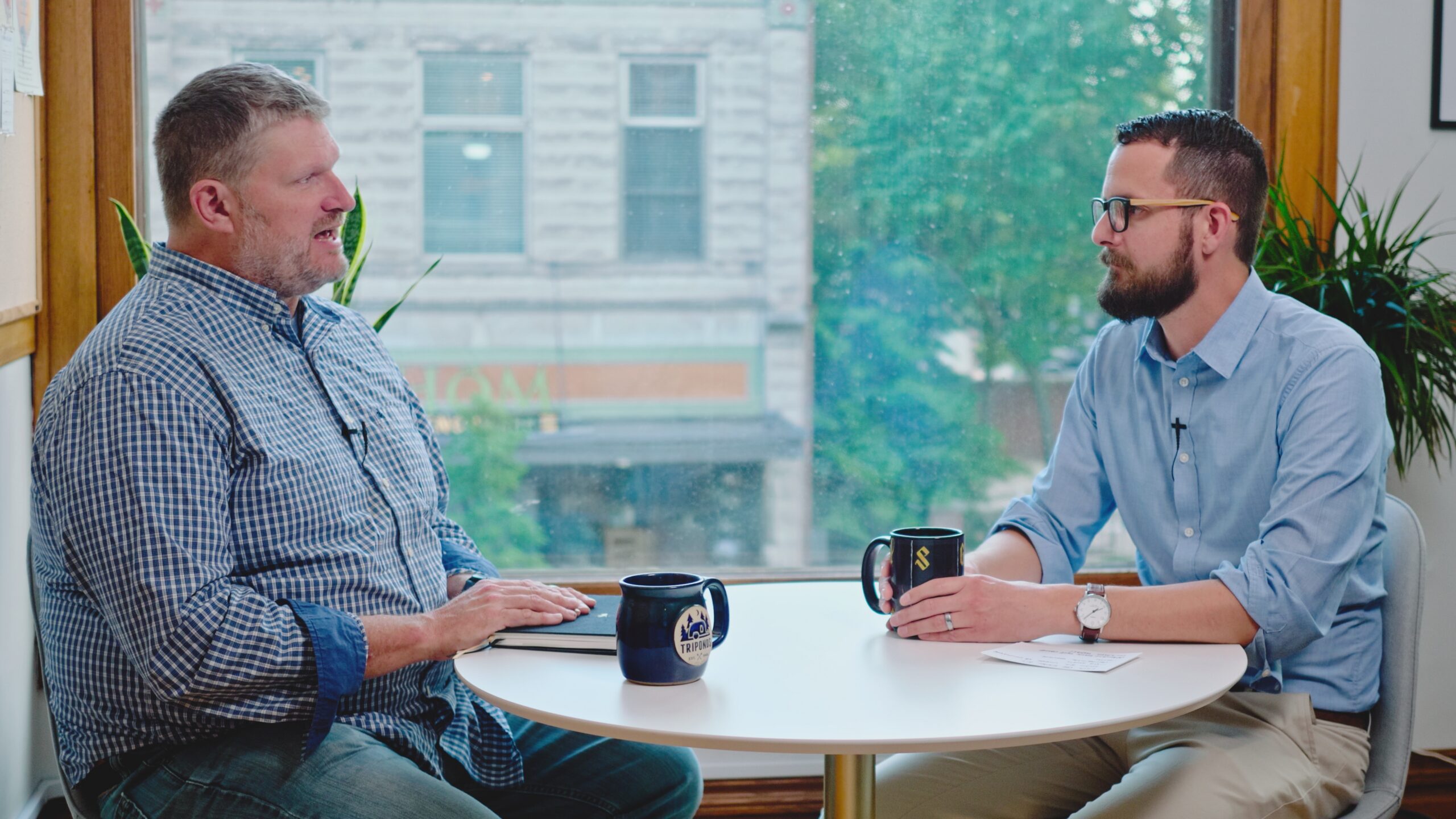 Dan Broersma and Vince Boileau sitting at a table having a conversation